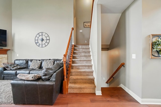 stairs featuring baseboards and wood finished floors