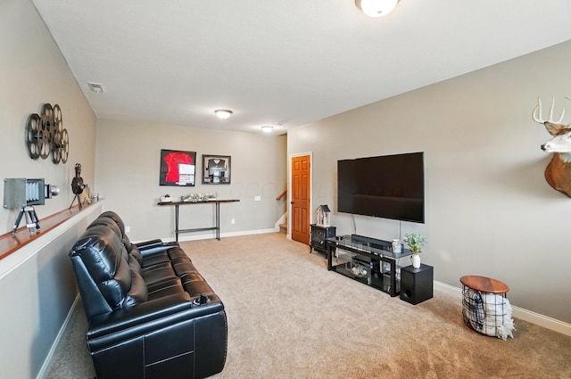 carpeted living room with baseboards and visible vents