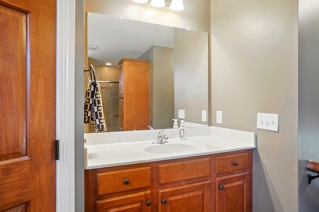 bathroom with vanity and a shower