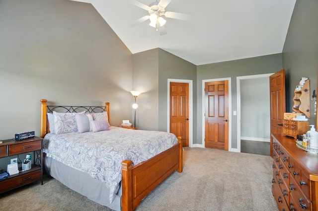 bedroom featuring baseboards, carpet, ceiling fan, and vaulted ceiling