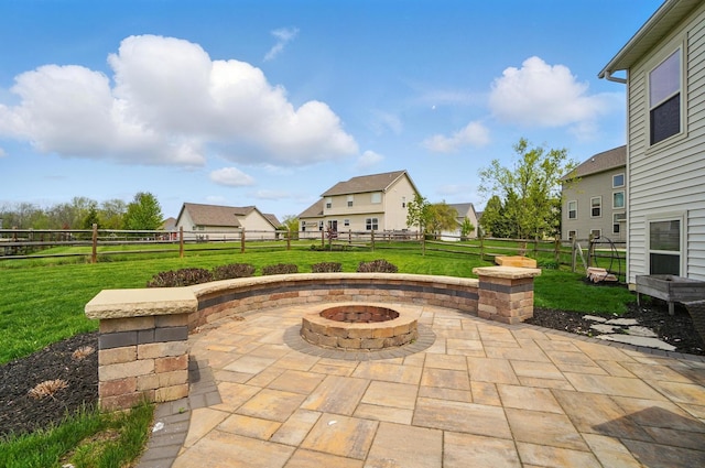 view of patio with a fenced backyard and an outdoor fire pit