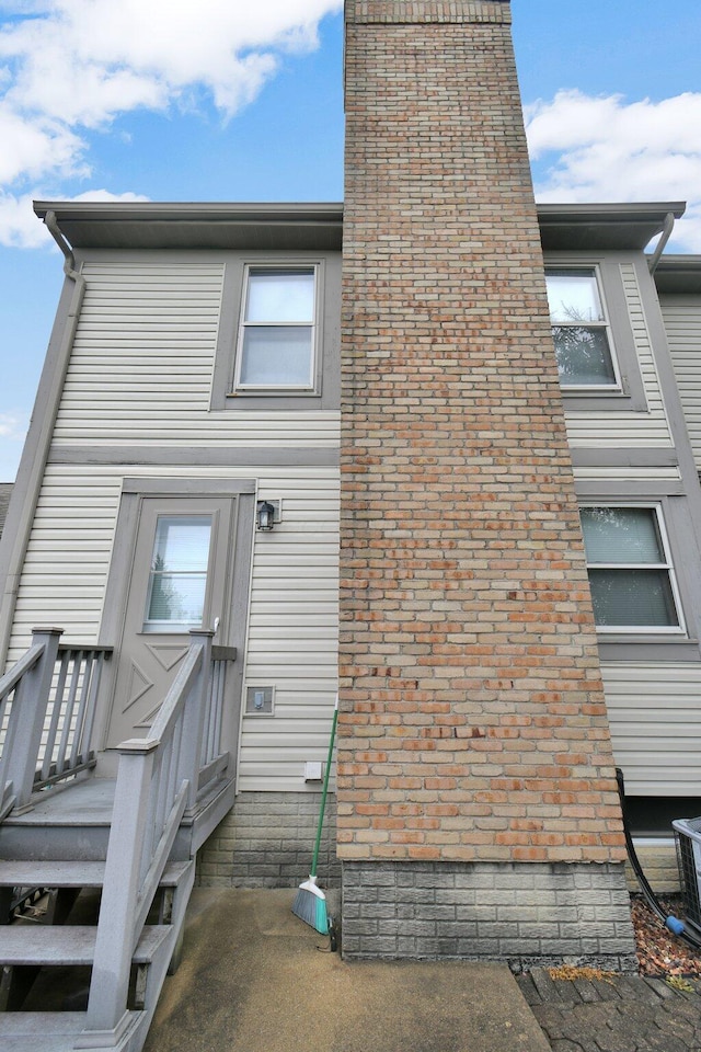 rear view of house with a chimney