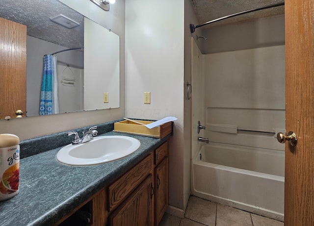 bathroom with tile patterned floors, vanity, a textured ceiling, and shower / tub combo with curtain