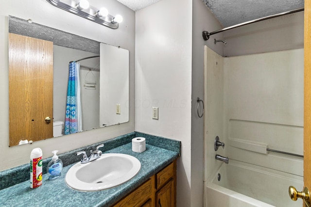 353 Clarendon Ave, Columbus, OH 43223 - full bathroom with shower / bath combo with shower curtain, vanity, a textured ceiling, and toilet
