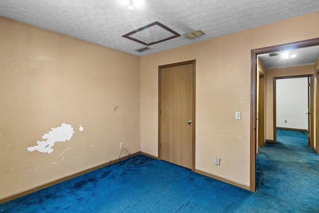 353 Clarendon Ave, Columbus, OH 43223 - unfurnished bedroom with carpet flooring, baseboards, a textured ceiling, and a closet