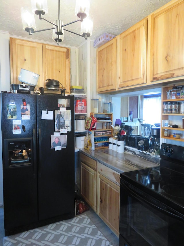 kitchen featuring light brown cabinetry, dark countertops, a chandelier, and black appliances