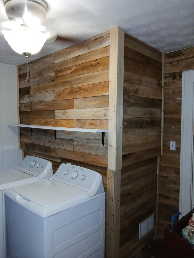 91 Madison Ave, Newark, OH 43055 - laundry room featuring wood walls and washer and dryer
