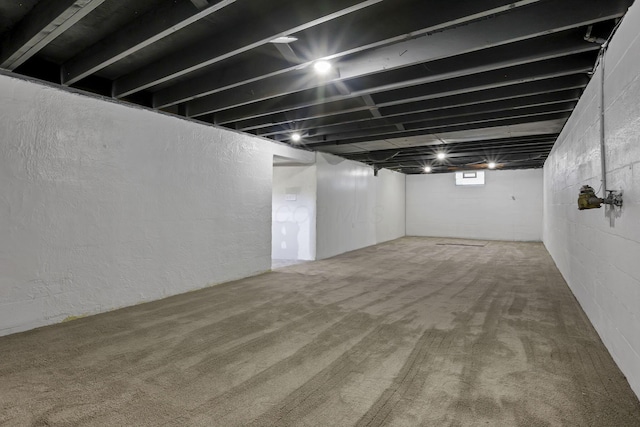 below grade area featuring carpet floors