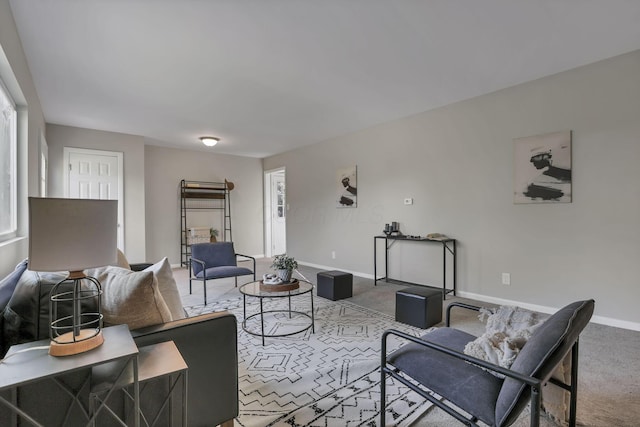 living room featuring carpet floors and baseboards