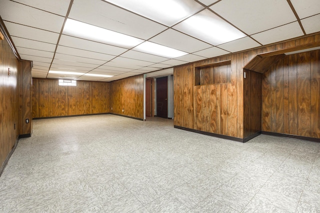 5308 Sharon Ave, Columbus, OH 43214 - basement with light flooring, wood walls, baseboards, and a drop ceiling