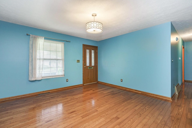 5308 Sharon Ave, Columbus, OH 43214 - foyer entrance with baseboards and light wood-style flooring