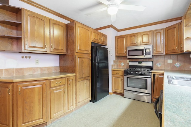 5308 Sharon Ave, Columbus, OH 43214 - kitchen with appliances with stainless steel finishes, open shelves, ceiling fan, light countertops, and a sink