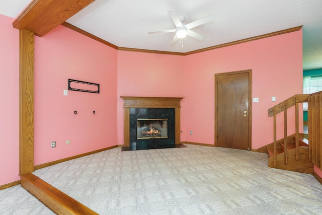 5308 Sharon Ave, Columbus, OH 43214 - carpeted living room featuring a ceiling fan, a fireplace, crown molding, stairway, and baseboards