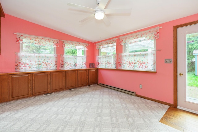 5308 Sharon Ave, Columbus, OH 43214 - unfurnished room featuring a baseboard heating unit, lofted ceiling, a ceiling fan, plenty of natural light, and light wood-style flooring