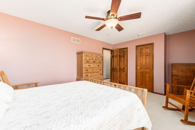 12385 Woodsfield Cir E, Pickerington, OH 43147 - bedroom with visible vents, ceiling fan, two closets, and light carpet