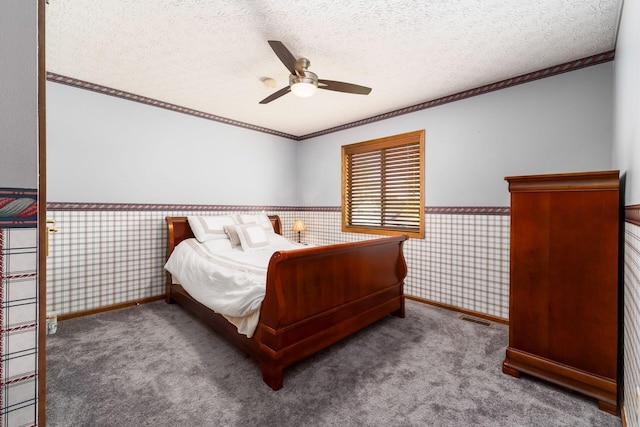 12385 Woodsfield Cir E, Pickerington, OH 43147 - carpeted bedroom featuring a textured ceiling, a wainscoted wall, baseboards, visible vents, and ornamental molding