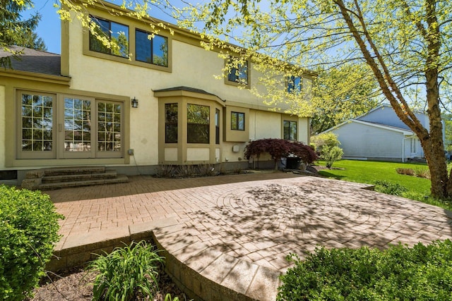 12385 Woodsfield Cir E, Pickerington, OH 43147 - rear view of house featuring a patio area and stucco siding