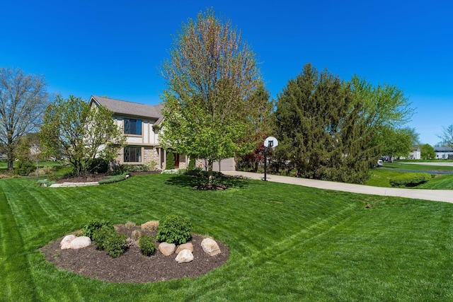 12385 Woodsfield Cir E, Pickerington, OH 43147 - view of yard with an attached garage and driveway