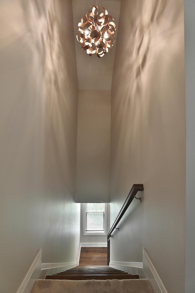 1012 Ewing Aly, Columbus, OH 43201 - staircase with baseboards and an inviting chandelier