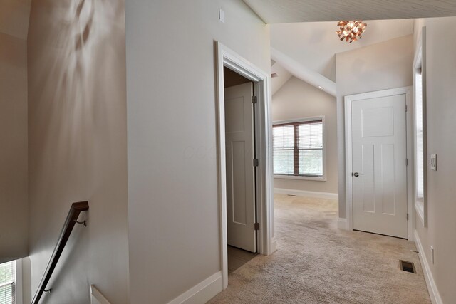 1012 Ewing Aly, Columbus, OH 43201 - corridor featuring visible vents, vaulted ceiling, baseboards, an upstairs landing, and light carpet
