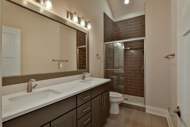 1012 Ewing Aly, Columbus, OH 43201 - bathroom with a sink, a shower stall, toilet, and double vanity