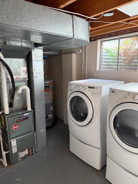 302 Saint Andrews Dr Unit 302, Dublin, OH 43017 - laundry room featuring water heater and washer and clothes dryer