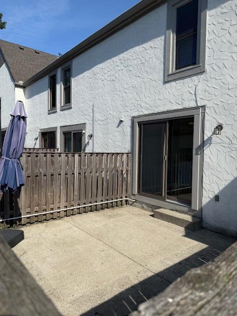 302 Saint Andrews Dr Unit 302, Dublin, OH 43017 - back of property with stucco siding and a patio