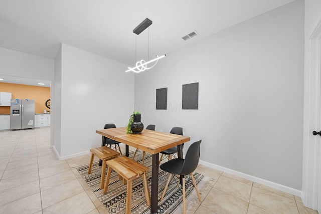 dining space featuring light tile patterned floors, a chandelier, baseboards, and recessed lighting