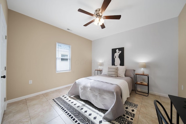bedroom featuring light tile patterned flooring, baseboards, and ceiling fan