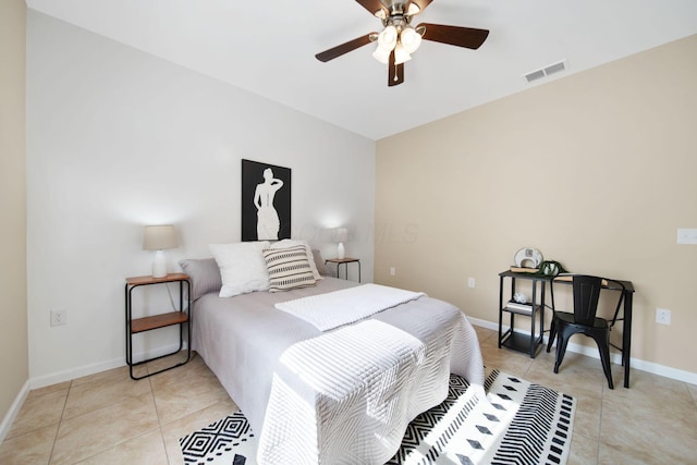 bedroom featuring light tile patterned flooring, baseboards, and a ceiling fan