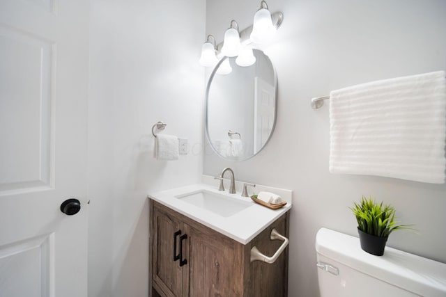 bathroom with toilet and vanity