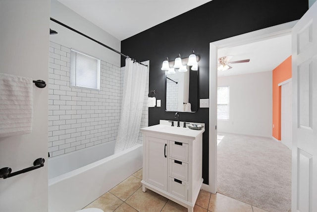 full bathroom featuring a ceiling fan, tile patterned floors, shower / bathtub combination with curtain, and vanity