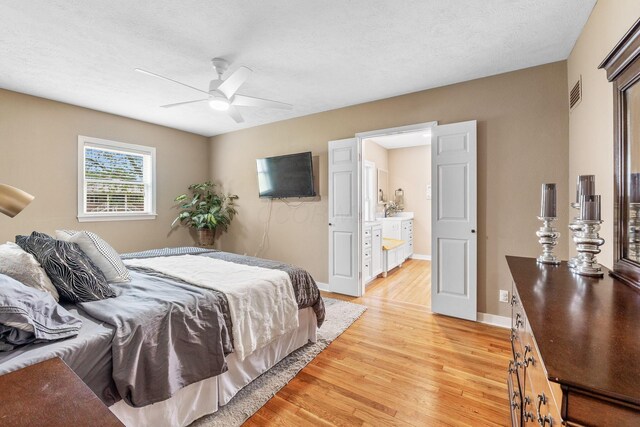 bedroom with ceiling fan, baseboards, visible vents, and light wood-style flooring