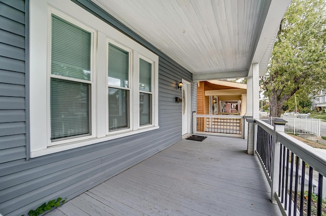 wooden terrace featuring a porch