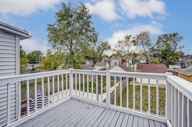 wooden terrace with a residential view