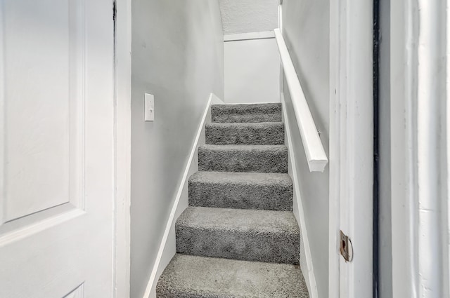 stairway with baseboards