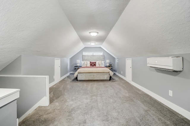 bedroom with baseboards, a wall mounted AC, and a textured ceiling