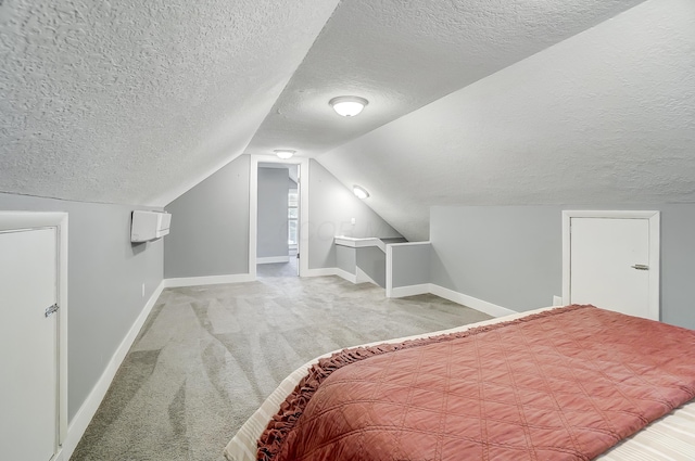 bedroom with baseboards, carpet floors, vaulted ceiling, and a textured ceiling