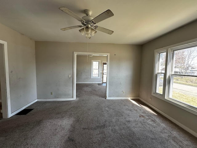 406 W Church St, Newark, OH 43055 - empty room featuring carpet floors, baseboards, and ceiling fan