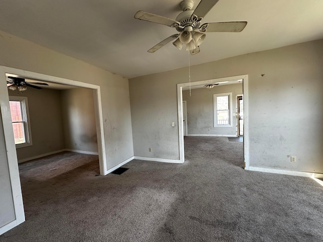 406 W Church St, Newark, OH 43055 - carpeted empty room with baseboards, a ceiling fan, and attic access