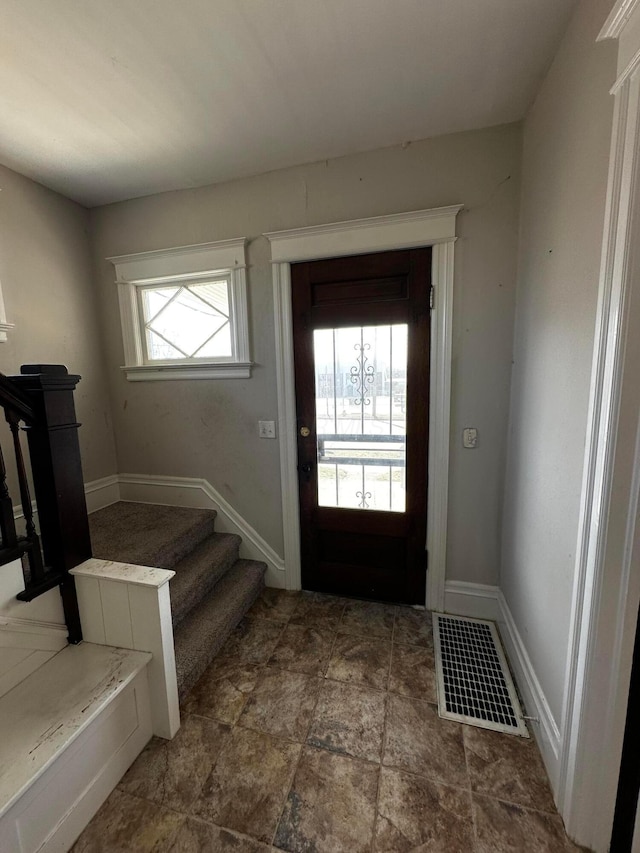 406 W Church St, Newark, OH 43055 - entryway with visible vents, stairs, and baseboards