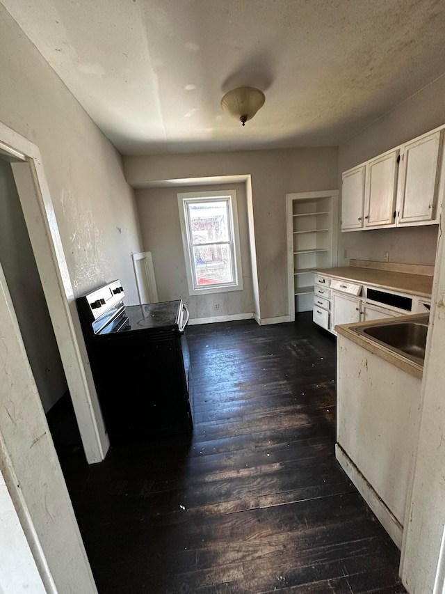 406 W Church St, Newark, OH 43055 - kitchen featuring a sink, dark wood-type flooring, white cabinetry, and electric stove