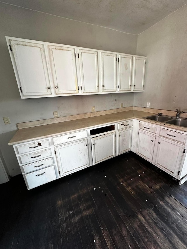 406 W Church St, Newark, OH 43055 - kitchen featuring a sink, dark wood-style flooring, white cabinets, and light countertops