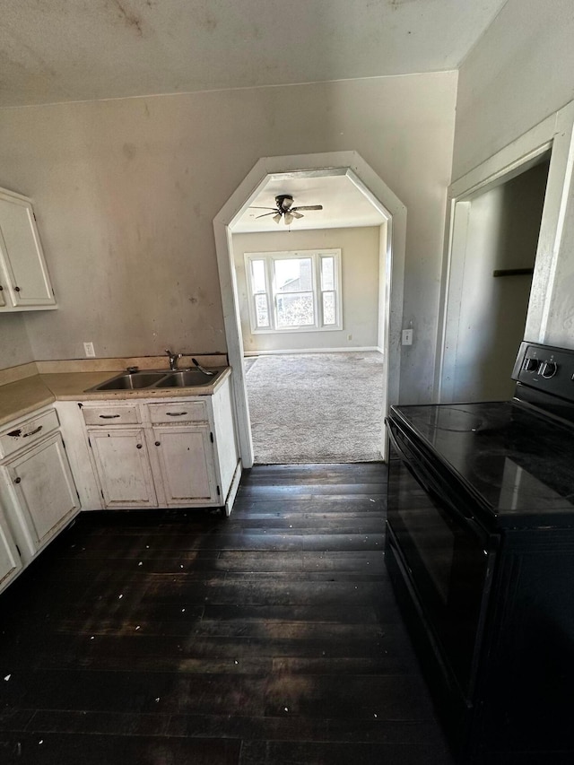 406 W Church St, Newark, OH 43055 - kitchen with a sink, white cabinets, electric range, and dark wood-style floors
