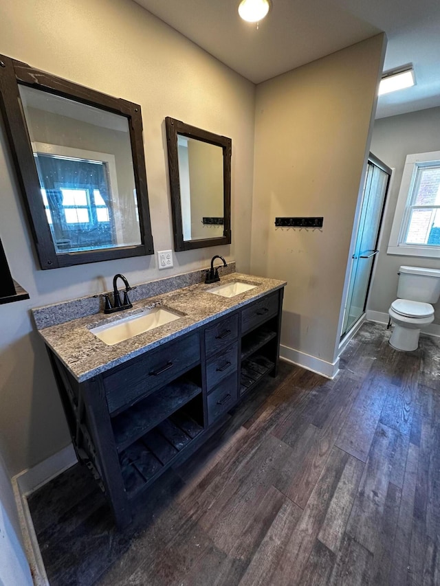 406 W Church St, Newark, OH 43055 - full bathroom featuring a sink, a stall shower, toilet, and wood finished floors