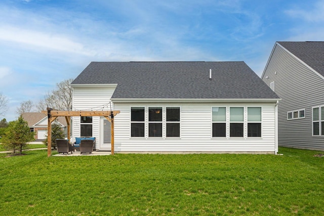 rear view of property with roof with shingles, a pergola, a yard, and a patio area
