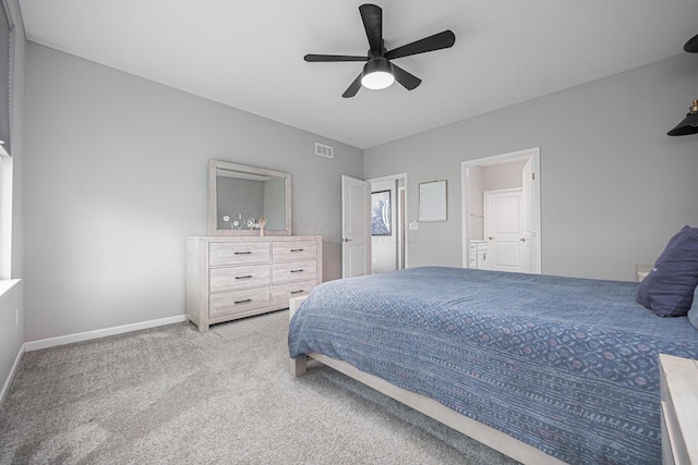 carpeted bedroom featuring a ceiling fan, baseboards, and visible vents