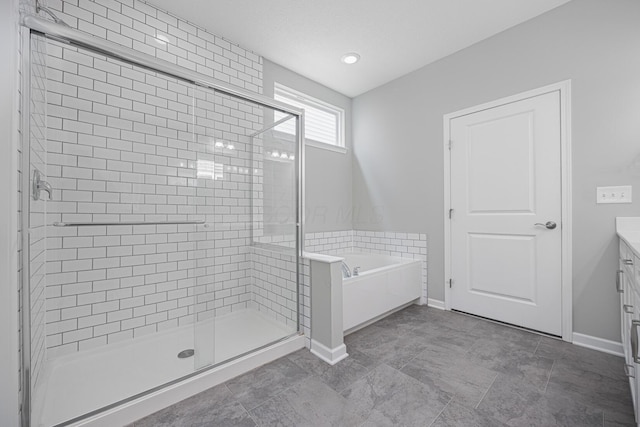 bathroom with vanity, baseboards, a shower stall, and a bath