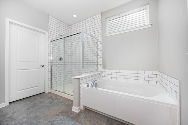 bathroom with a garden tub, recessed lighting, and a stall shower