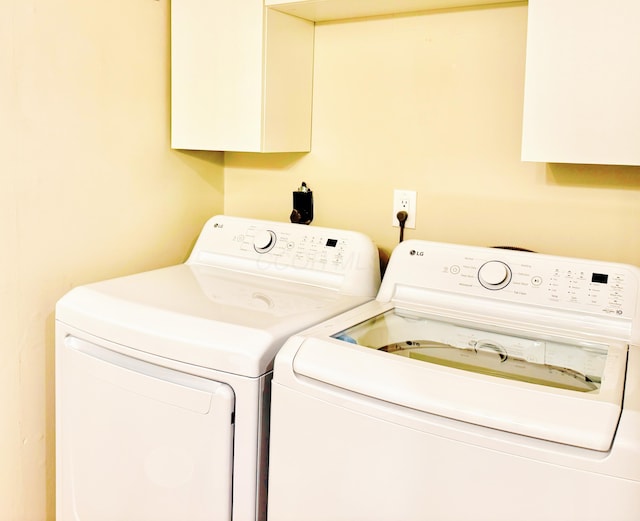 laundry area featuring separate washer and dryer and laundry area